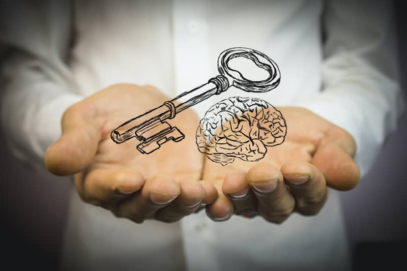 workplace man holding key brain